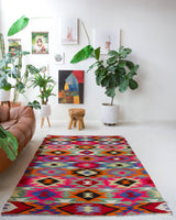 Vintage kilim rug in living room setting, bright colors, wild shaman, soft rug, bold color, Portland, Oregon, rug store, rug shop, local shop, vintage rug, modern kilim, warm colors