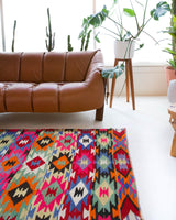 Vintage kilim rug in living room setting, bright colors, wild shaman, soft rug, bold color, Portland, Oregon, rug store, rug shop, local shop, vintage rug, modern kilim, warm colors