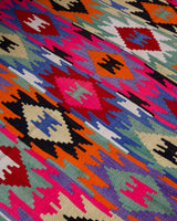 Vintage kilim rug in living room setting, bright colors, wild shaman, soft rug, bold color, Portland, Oregon, rug store, rug shop, local shop, vintage rug, modern kilim, warm colors