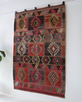 Vintage kilim rug in living room setting, bright colors, wild shaman, soft rug, bold color, Portland, Oregon, rug store, rug shop, local shop, vintage rug, modern kilim, warm colors