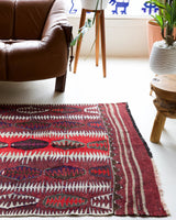 Vintage Turkish rug in a living room setting, pile rug, Turkish rug, vintage rug, portland, rug shop, bright colors, wild shaman, soft rug, bold color, Portland, Oregon, rug store, rug shop, local shop, antique rug