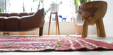 Vintage Turkish rug in a living room setting, pile rug, Turkish rug, vintage rug, portland, rug shop, bright colors, wild shaman, soft rug, bold color, Portland, Oregon, rug store, rug shop, local shop, antique rug