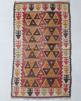 Vintage Turkish mini rug in room decor setting, old rug, antique rug, pastel colors, faded colors, Turkish rug, vintage rug, soft rug, Portland, Oregon, rug store, rug shop, local shop,  bright colors, bold colors