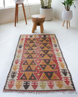Vintage Turkish mini rug in room decor setting, old rug, antique rug, pastel colors, faded colors, Turkish rug, vintage rug, soft rug, Portland, Oregon, rug store, rug shop, local shop,  bright colors, bold colors
