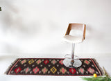 Vintage Turkish runner rug in a living room setting, pile rug, Turkish rug, vintage rug, portland, rug shop, bright colors, wild shaman, soft rug, bold color, Portland, Oregon, rug store, rug shop, local shop, antique rug