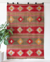 Vintage kilim rug in room decor setting, old rug, antique rug, pastel colors, faded colors, Turkish rug, vintage rug, soft rug, Portland, Oregon, rug store, rug shop, local shop, bold colors, bright colors, faded colors