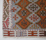 Vintage Turkish mini rug in room decor setting, old rug, antique rug, pastel colors, faded colors, Turkish rug, vintage rug, soft rug, Portland, Oregon, rug store, rug shop, local shop,  bright colors, bold colors