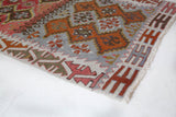 Vintage Turkish mini rug in room decor setting, old rug, antique rug, pastel colors, faded colors, Turkish rug, vintage rug, soft rug, Portland, Oregon, rug store, rug shop, local shop,  bright colors, bold colors