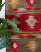 Vintage kilim rug in room decor setting, old rug, antique rug, pastel colors, faded colors, Turkish rug, vintage rug, soft rug, Portland, Oregon, rug store, rug shop, local shop, bold colors, bright colors, faded colors