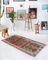 Vintage Turkish mini rug in room decor setting, old rug, antique rug, pastel colors, faded colors, Turkish rug, vintage rug, soft rug, Portland, Oregon, rug store, rug shop, local shop,  bright colors, bold colors