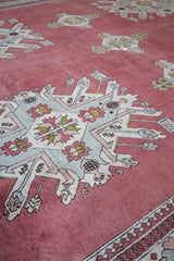 Area rug in a living room setting, pile rug, Turkish rug, old rug, antique rug, pastel colors, faded colors, Turkish rug, vintage rug, soft rug, Portland, Oregon, rug store, rug shop, local shop, distressed rug, worn out rug