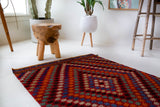 Vintage mini kilim rug in room decor setting, kilim, Turkish rug, vintage rug, portland, rug shop, bright colors, wild shaman, soft rug, bold color, Portland, Oregon, rug store, rug shop, local shop
