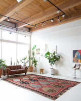 Vintage kilim rug in room decor setting, old rug, antique rug, pastel colors, faded colors, Turkish rug, vintage rug, soft rug, Portland, Oregon, rug store, rug shop, local shop, bold colors, bright colors, faded colors