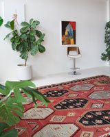 Vintage kilim rug in room decor setting, old rug, antique rug, pastel colors, faded colors, Turkish rug, vintage rug, soft rug, Portland, Oregon, rug store, rug shop, local shop, bold colors, bright colors, faded colors