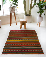 Vintage mini kilim rug in room decor setting, kilim, Turkish rug, vintage rug, portland, rug shop, bright colors, wild shaman, soft rug, bold color, Portland, Oregon, rug store, rug shop, local shop