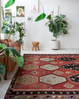 Vintage kilim rug in room decor setting, old rug, antique rug, pastel colors, faded colors, Turkish rug, vintage rug, soft rug, Portland, Oregon, rug store, rug shop, local shop, bold colors, bright colors, faded colors