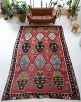 Vintage kilim rug in room decor setting, old rug, antique rug, pastel colors, faded colors, Turkish rug, vintage rug, soft rug, Portland, Oregon, rug store, rug shop, local shop, bold colors, bright colors, faded colors