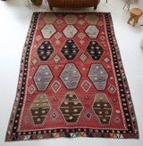 Vintage kilim rug in room decor setting, old rug, antique rug, pastel colors, faded colors, Turkish rug, vintage rug, soft rug, Portland, Oregon, rug store, rug shop, local shop, bold colors, bright colors, faded colors