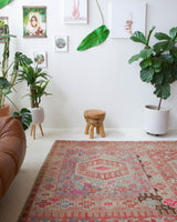 Vintage kilim rug in living room setting, old rug, antique rug, pastel colors, faded colors, Turkish rug, vintage rug, soft rug, Portland, Oregon, rug store, rug shop, local shop, earthy tones, earthy colors, warm colors