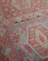 Vintage kilim rug in living room setting, old rug, antique rug, pastel colors, faded colors, Turkish rug, vintage rug, soft rug, Portland, Oregon, rug store, rug shop, local shop, earthy tones, earthy colors, warm colors