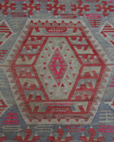 Vintage kilim rug in living room setting, old rug, antique rug, pastel colors, faded colors, Turkish rug, vintage rug, soft rug, Portland, Oregon, rug store, rug shop, local shop, earthy tones, earthy colors, warm colors