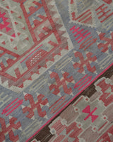 Vintage kilim rug in living room setting, old rug, antique rug, pastel colors, faded colors, Turkish rug, vintage rug, soft rug, Portland, Oregon, rug store, rug shop, local shop, earthy tones, earthy colors, warm colors