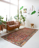 Vintage kilim rug in living room setting, old rug, antique rug, pastel colors, faded colors, Turkish rug, vintage rug, soft rug, Portland, Oregon, rug store, rug shop, local shop, earthy tones, earthy colors, warm colors