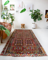 Vintage kilim rug in living room setting, old rug, antique rug, pastel colors, faded colors, Turkish rug, vintage rug, soft rug, Portland, Oregon, rug store, rug shop, local shop, earthy tones, earthy colors, warm colors