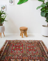 Vintage kilim rug in living room setting, old rug, antique rug, pastel colors, faded colors, Turkish rug, vintage rug, soft rug, Portland, Oregon, rug store, rug shop, local shop, earthy tones, earthy colors, warm colors
