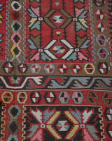 Vintage kilim rug in living room setting, old rug, antique rug, pastel colors, faded colors, Turkish rug, vintage rug, soft rug, Portland, Oregon, rug store, rug shop, local shop, earthy tones, earthy colors, warm colors