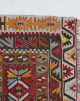 Vintage kilim rug in living room setting, old rug, antique rug, pastel colors, faded colors, Turkish rug, vintage rug, soft rug, Portland, Oregon, rug store, rug shop, local shop, earthy tones, earthy colors, warm colors