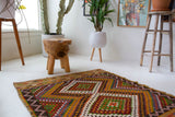 Vintage mini kilim rug in room decor setting, kilim, Turkish rug, vintage rug, portland, rug shop, bright colors, wild shaman, soft rug, bold color, Portland, Oregon, rug store, rug shop, local shop