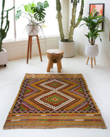 Vintage mini kilim rug in room decor setting, kilim, Turkish rug, vintage rug, portland, rug shop, bright colors, wild shaman, soft rug, bold color, Portland, Oregon, rug store, rug shop, local shop