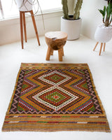 Vintage mini kilim rug in room decor setting, kilim, Turkish rug, vintage rug, portland, rug shop, bright colors, wild shaman, soft rug, bold color, Portland, Oregon, rug store, rug shop, local shop