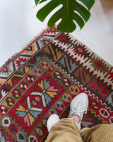 Vintage kilim rug in living room setting, old rug, antique rug, pastel colors, faded colors, Turkish rug, vintage rug, soft rug, Portland, Oregon, rug store, rug shop, local shop, earthy tones, earthy colors, warm colors