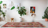 Vintage kilim rug in living room setting, old rug, antique rug, pastel colors, faded colors, Turkish rug, vintage rug, soft rug, Portland, Oregon, rug store, rug shop, local shop, earthy tones, earthy colors, warm colors