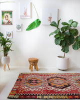 Vintage kilim rug in living room setting, old rug, antique rug, pastel colors, faded colors, Turkish rug, vintage rug, soft rug, Portland, Oregon, rug store, rug shop, local shop, earthy tones, earthy colors, warm colors