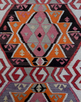 Vintage kilim rug in living room setting, old rug, antique rug, pastel colors, faded colors, Turkish rug, vintage rug, soft rug, Portland, Oregon, rug store, rug shop, local shop, earthy tones, earthy colors, warm colors