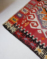 Vintage kilim rug in living room setting, old rug, antique rug, pastel colors, faded colors, Turkish rug, vintage rug, soft rug, Portland, Oregon, rug store, rug shop, local shop, earthy tones, earthy colors, warm colors