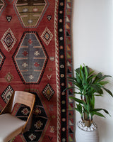 Vintage kilim rug in room decor setting, old rug, antique rug, pastel colors, faded colors, Turkish rug, vintage rug, soft rug, Portland, Oregon, rug store, rug shop, local shop, bold colors, bright colors, faded colors