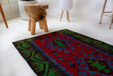 Vintage mini kilim rug in room decor setting, kilim, Turkish rug, vintage rug, portland, rug shop, bright colors, wild shaman, soft rug, bold color, Portland, Oregon, rug store, rug shop, local shop