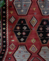 Vintage kilim rug in room decor setting, old rug, antique rug, pastel colors, faded colors, Turkish rug, vintage rug, soft rug, Portland, Oregon, rug store, rug shop, local shop, bold colors, bright colors, faded colors