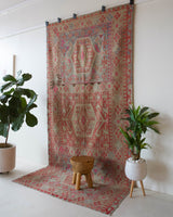 Vintage kilim rug in living room setting, old rug, antique rug, pastel colors, faded colors, Turkish rug, vintage rug, soft rug, Portland, Oregon, rug store, rug shop, local shop, earthy tones, earthy colors, warm colors