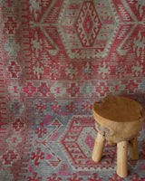 Vintage kilim rug in living room setting, old rug, antique rug, pastel colors, faded colors, Turkish rug, vintage rug, soft rug, Portland, Oregon, rug store, rug shop, local shop, earthy tones, earthy colors, warm colors