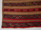 Vintage Turkish mini rug in room decor setting, old rug, antique rug, pastel colors, faded colors, Turkish rug, vintage rug, soft rug, Portland, Oregon, rug store, rug shop, local shop,  bright colors, bold colors
