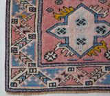 Vintage Turkish runner rug in living room setting, old rug, antique rug, pastel colors, faded colors, Turkish rug, vintage rug, soft rug, Portland, Oregon, rug store, rug shop, local shop