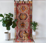 Vintage kilim rug in living room setting, old rug, antique rug, pastel colors, faded colors, Turkish rug, vintage rug, soft rug, Portland, Oregon, rug store, rug shop, local shop, earthy tones, earthy colors, warm colors