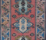 Vintage Turkish runner rug in living room setting, old rug, antique rug, pastel colors, faded colors, Turkish rug, vintage rug, soft rug, Portland, Oregon, rug store, rug shop, local shop