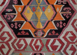 Vintage kilim rug in living room setting, old rug, antique rug, pastel colors, faded colors, Turkish rug, vintage rug, soft rug, Portland, Oregon, rug store, rug shop, local shop, earthy tones, earthy colors, warm colors
