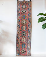 Vintage Turkish runner rug in living room setting, old rug, antique rug, pastel colors, faded colors, Turkish rug, vintage rug, soft rug, Portland, Oregon, rug store, rug shop, local shop